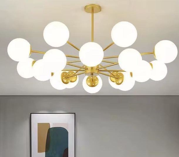 Lustre sputnik doré avec globes blancs — Watts Energy, matériel électrique Dakar Sénégal